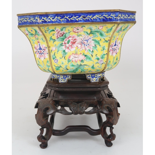 2401 - A CANTON ENAMEL YELLOW GROUND JARDINIERE Painted with peonies and scrolling foliage, beneath a blue ... 