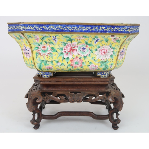 2401 - A CANTON ENAMEL YELLOW GROUND JARDINIERE Painted with peonies and scrolling foliage, beneath a blue ... 