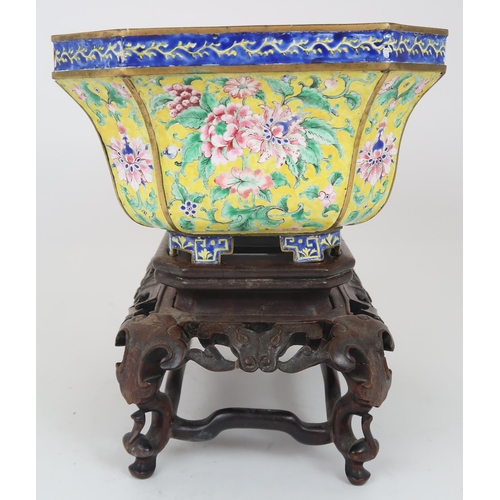 2401 - A CANTON ENAMEL YELLOW GROUND JARDINIERE Painted with peonies and scrolling foliage, beneath a blue ... 