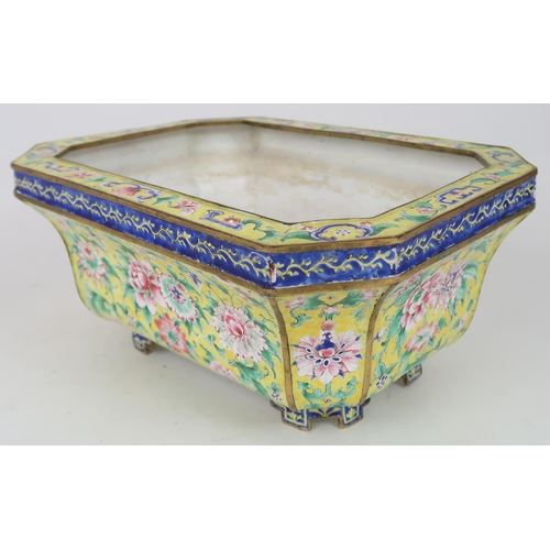 2401 - A CANTON ENAMEL YELLOW GROUND JARDINIERE Painted with peonies and scrolling foliage, beneath a blue ... 