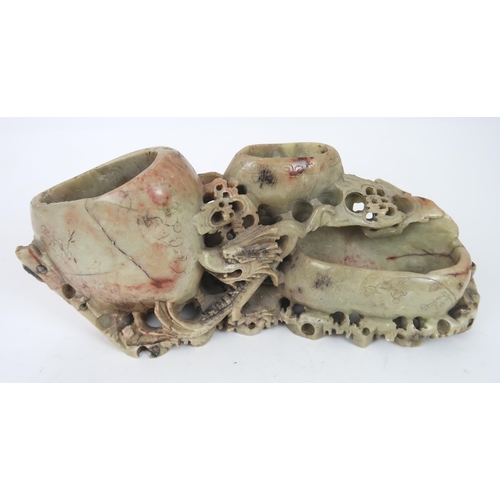 2402 - A CHINESE HARDSTONE COUPE Carved with foliage around the mouth, 11cm diameter, soapstone carving, 26... 