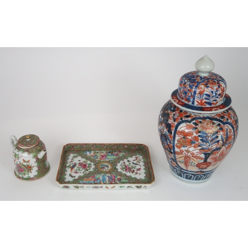 2404 - AN IMARI JAR AND COVER Painted with foliage, 32cm high, a Canton teapot, 12cm high and tray, 25... 