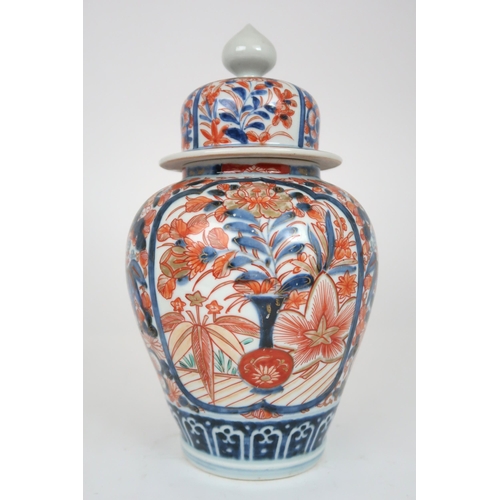 2404 - AN IMARI JAR AND COVER Painted with foliage, 32cm high, a Canton teapot, 12cm high and tray, 25... 