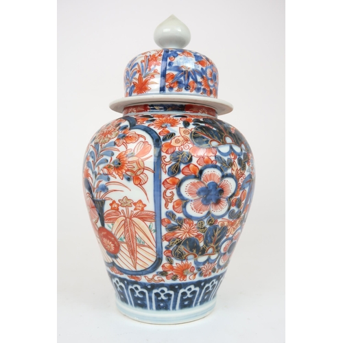 2404 - AN IMARI JAR AND COVER Painted with foliage, 32cm high, a Canton teapot, 12cm high and tray, 25... 