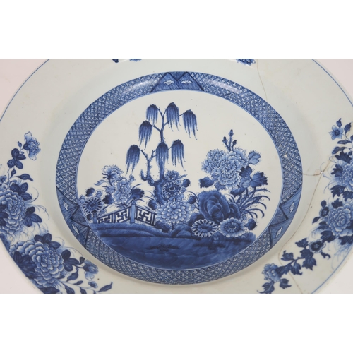 2405 - A LARGE CHINESE EXPORT BLUE AND WHITE DISH Painted with a willow tree, chrysanthemum, peonies a... 