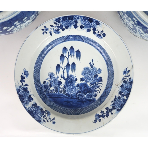 2405 - A LARGE CHINESE EXPORT BLUE AND WHITE DISH Painted with a willow tree, chrysanthemum, peonies a... 