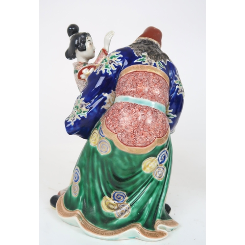 2406 - AN ARITA MODEL OF A WARRIOR AND GEISHA She slapping his face and he grimacing, 25cm high, a Chinese ... 