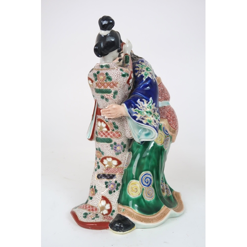 2406 - AN ARITA MODEL OF A WARRIOR AND GEISHA She slapping his face and he grimacing, 25cm high, a Chinese ... 