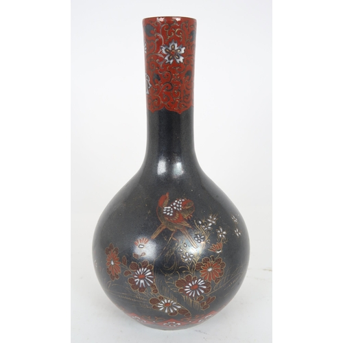 2407 - A CHINESE BALUSTER VASE Painted with polychrome colours on a dark ground with birds amongst fol... 