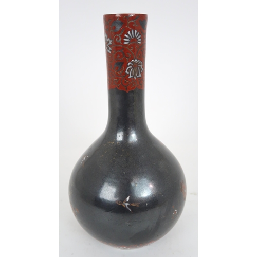 2407 - A CHINESE BALUSTER VASE Painted with polychrome colours on a dark ground with birds amongst fol... 