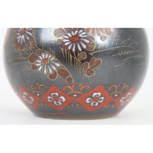 2407 - A CHINESE BALUSTER VASE Painted with polychrome colours on a dark ground with birds amongst fol... 