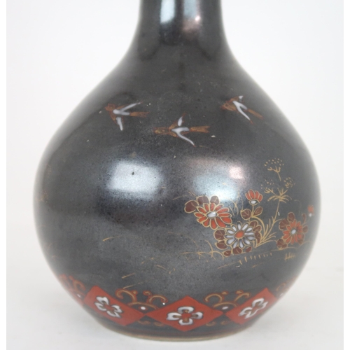 2407 - A CHINESE BALUSTER VASE Painted with polychrome colours on a dark ground with birds amongst fol... 