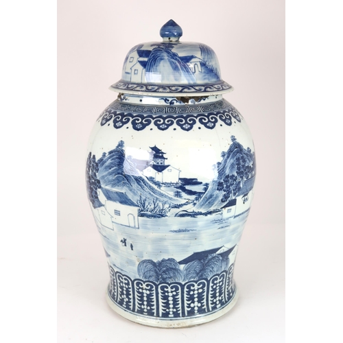 2408 - A CHINESE EXPORT BLUE AND WHITE TEA JAR AND A COVER Painted with figures approaching a bri... 