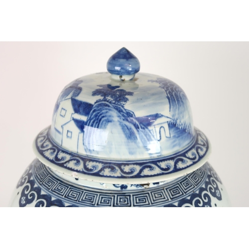 2408 - A CHINESE EXPORT BLUE AND WHITE TEA JAR AND A COVER Painted with figures approaching a bri... 