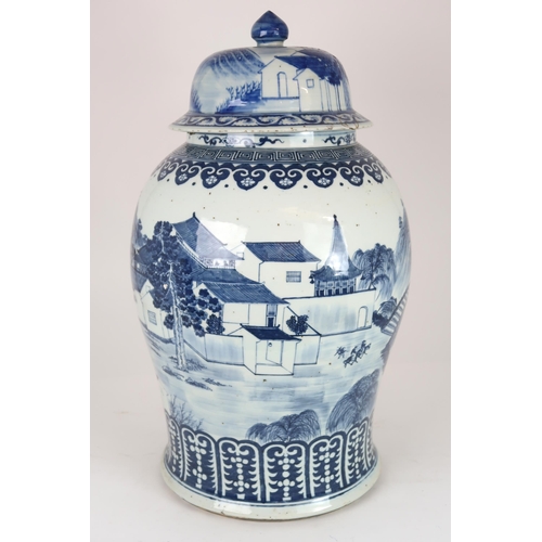 2408 - A CHINESE EXPORT BLUE AND WHITE TEA JAR AND A COVER Painted with figures approaching a bri... 