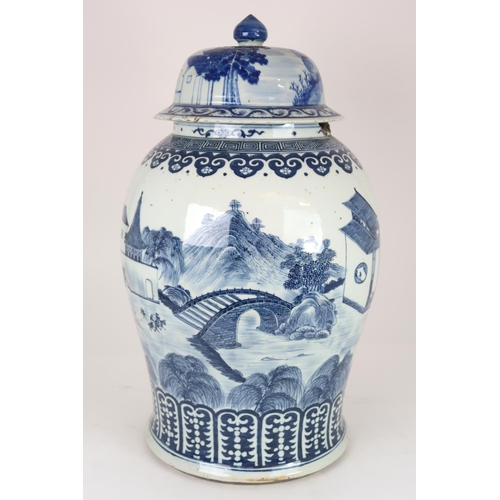 2408 - A CHINESE EXPORT BLUE AND WHITE TEA JAR AND A COVER Painted with figures approaching a bri... 