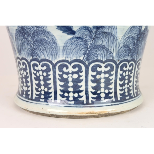 2408 - A CHINESE EXPORT BLUE AND WHITE TEA JAR AND A COVER Painted with figures approaching a bri... 