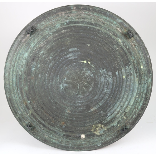 2409 - A LAOTIAN BRONZE RAIN DRUM Of traditional type, with applied animals to top and pierced strap h... 