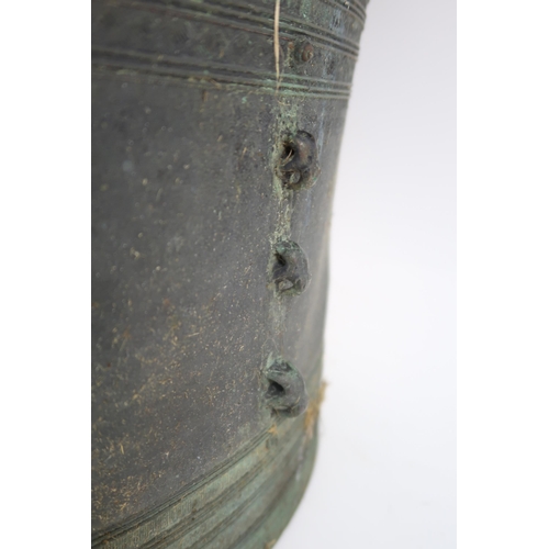 2409 - A LAOTIAN BRONZE RAIN DRUM Of traditional type, with applied animals to top and pierced strap h... 