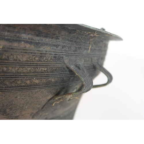 2409 - A LAOTIAN BRONZE RAIN DRUM Of traditional type, with applied animals to top and pierced strap h... 