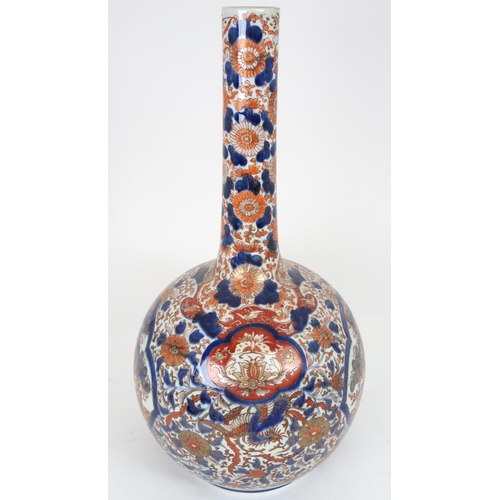 2411 - A LARGE IMARI BOTTLE SHAPED VASE Painted with ogival shaped panel enclosing pine trees, birds a... 