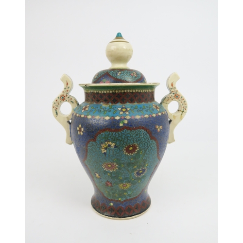 2418 - AN ASIAN POTTERY AND CLOISONNE TWO HANDLED VASE AND COVER Decorated with ogival shaped panels o... 