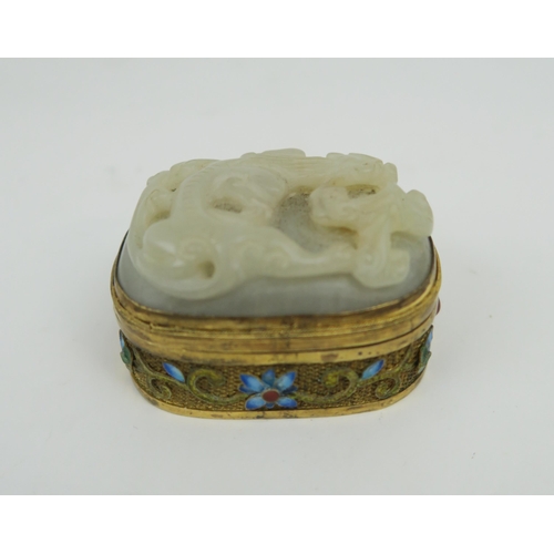 2422 - A CHINESE HARDSTONE, SILVER GILT AND ENAMEL BOX The cover carved as a chilong,the gilt metal sides d... 