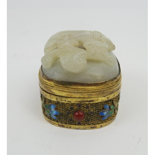 2422 - A CHINESE HARDSTONE, SILVER GILT AND ENAMEL BOX The cover carved as a chilong,the gilt metal sides d... 