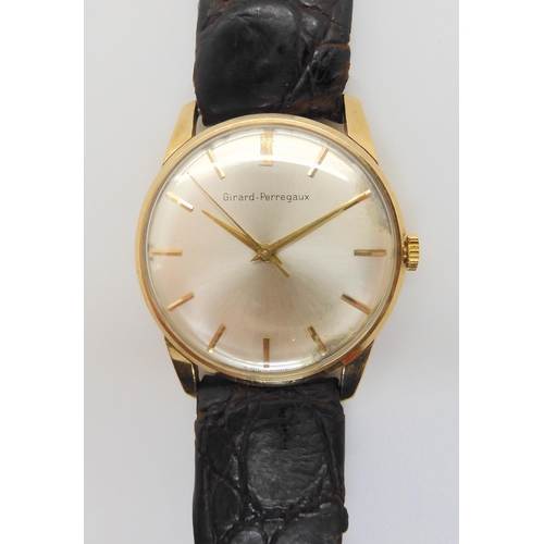 2885 - A 9CT GOLD GIRARD PEREGAUX WATCHwith cream dial, gold baton numerals and hands. Diameter of the case... 