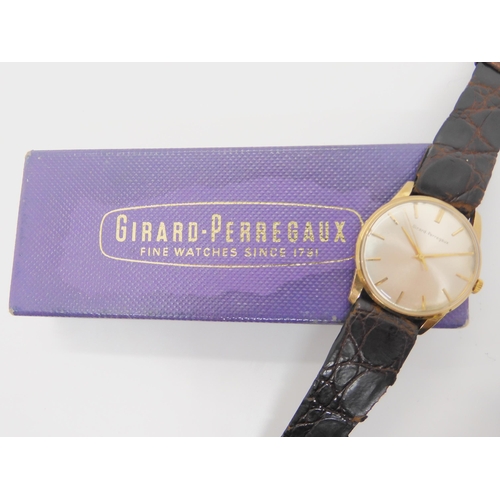 2885 - A 9CT GOLD GIRARD PEREGAUX WATCHwith cream dial, gold baton numerals and hands. Diameter of the case... 