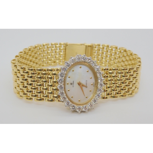 2888B - A 14K GOLD DIAMOND SET CYMA LADIES WATCHmother of pearl dial with gold dot numerals, set with estima... 