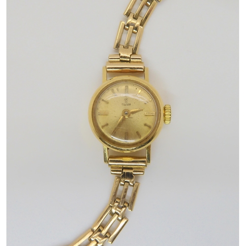 2889 - A 18CT GOLD LADIES TUDOR WATCH HEADwith gold coloured dial, gold coloured baton numerals and hands, ... 