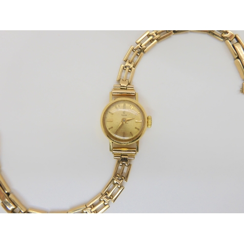 2889 - A 18CT GOLD LADIES TUDOR WATCH HEADwith gold coloured dial, gold coloured baton numerals and hands, ... 