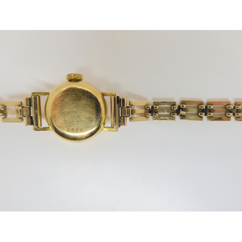 2889 - A 18CT GOLD LADIES TUDOR WATCH HEADwith gold coloured dial, gold coloured baton numerals and hands, ... 