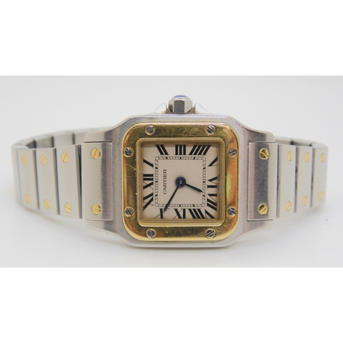 2890 - A LADIES CARTIER WATCHin gold and stainless steel, with cream dial, black Roman numerals and blued s... 