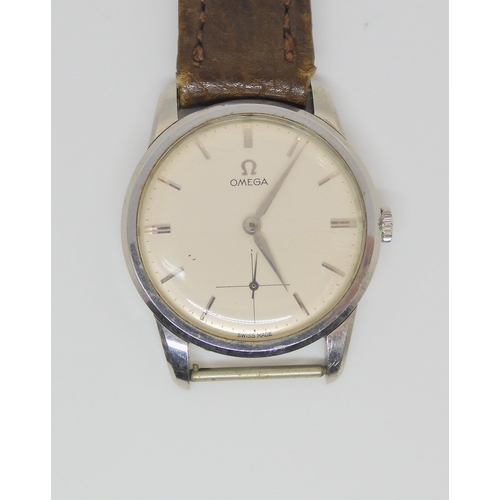 2893 - A VINTAGE OMEGA WATCHwith white dial silver coloured baton numerals and hands with subsidiary second... 