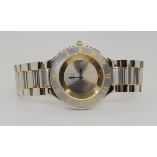 2894 - *WITHDRAWN* A MUST DE CARTIER 21 WATCHwith two tone dial and blued steel hands, jewel set winder and... 