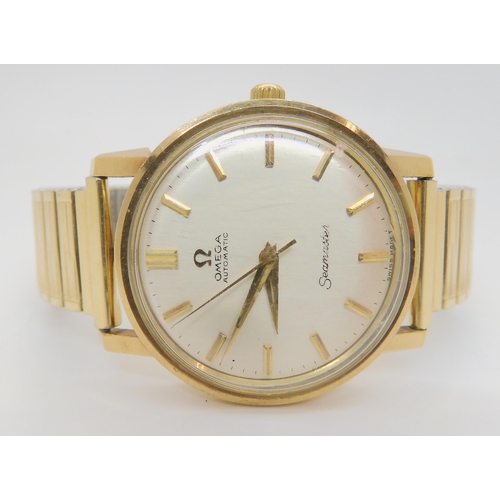 2896A - A 9CT GOLD GENTS OMEGA SEAMASTER AUTOMATICwith silvered dial with gold coloured baton numerals, diam... 