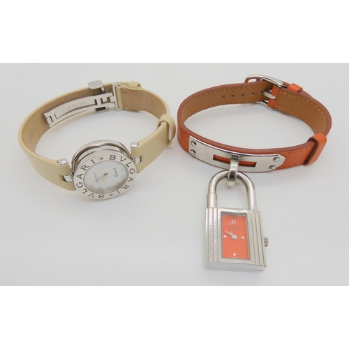 2897 - HERMES & BULGARI WATCHESHermes watch with orange leather strap, and stainless steel padlock styl... 