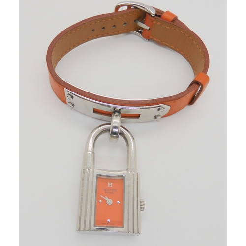 2897 - HERMES & BULGARI WATCHESHermes watch with orange leather strap, and stainless steel padlock styl... 