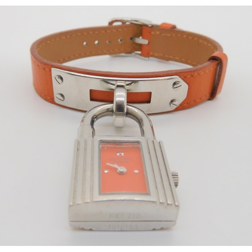 2897 - HERMES & BULGARI WATCHESHermes watch with orange leather strap, and stainless steel padlock styl... 