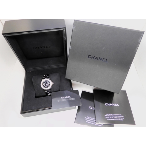 2898B - A DIAMOND CHANEL J12 QUARTZ WATCHthe case and the strap in black ceramic, with diamond set bezel. Th... 