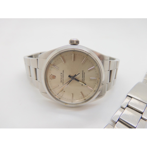 2899D - A ROLEX OYSTER PERPETUALwith stainless steel case and strap (78350). Silvered dial with silver colou... 