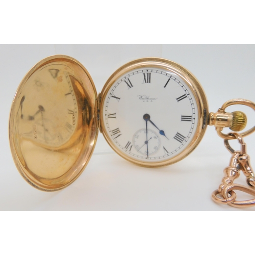 2900 - A 9CT GOLD WALTHAM FULL HUNTERwith white enamelled dial with black roman numerals, subsidiary second... 