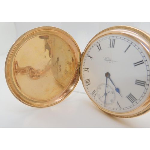 2900 - A 9CT GOLD WALTHAM FULL HUNTERwith white enamelled dial with black roman numerals, subsidiary second... 