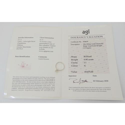 2707 - A DIAMOND SOLITAIRE RINGset with an estimated approx 0.94ct brilliant cut diamond with a AGI certifi... 