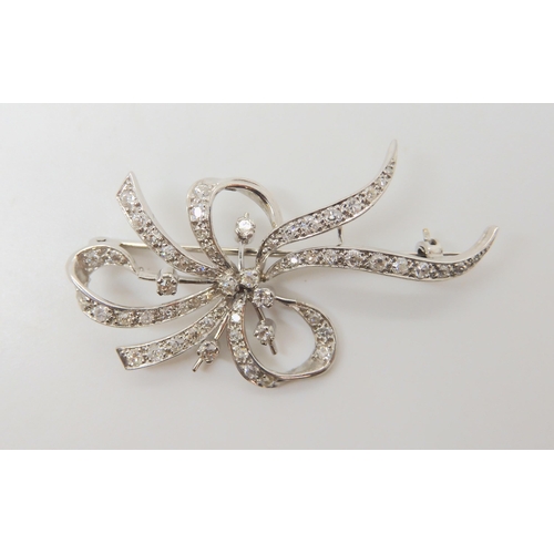 2710 - A DIAMOND SPRAY BROOCHthe white metal mount is craftsman made and set with estimated approx 0.96cts ... 