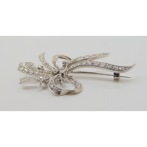 2710 - A DIAMOND SPRAY BROOCHthe white metal mount is craftsman made and set with estimated approx 0.96cts ... 