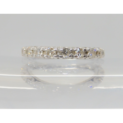 2714 - A DIAMOND SET FULL ETERNITY RINGthe white metal mount is set with estimated approx 0.80cts, finger s... 