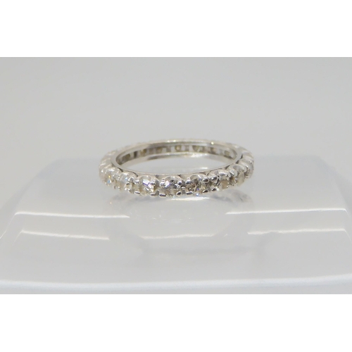 2714 - A DIAMOND SET FULL ETERNITY RINGthe white metal mount is set with estimated approx 0.80cts, finger s... 